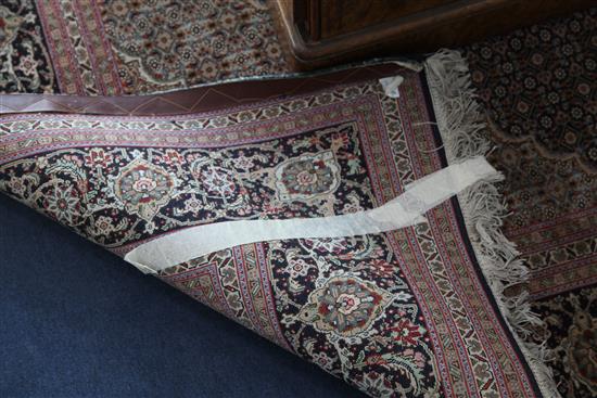 A central Persian carpet, 10ft by 6ft 8in.